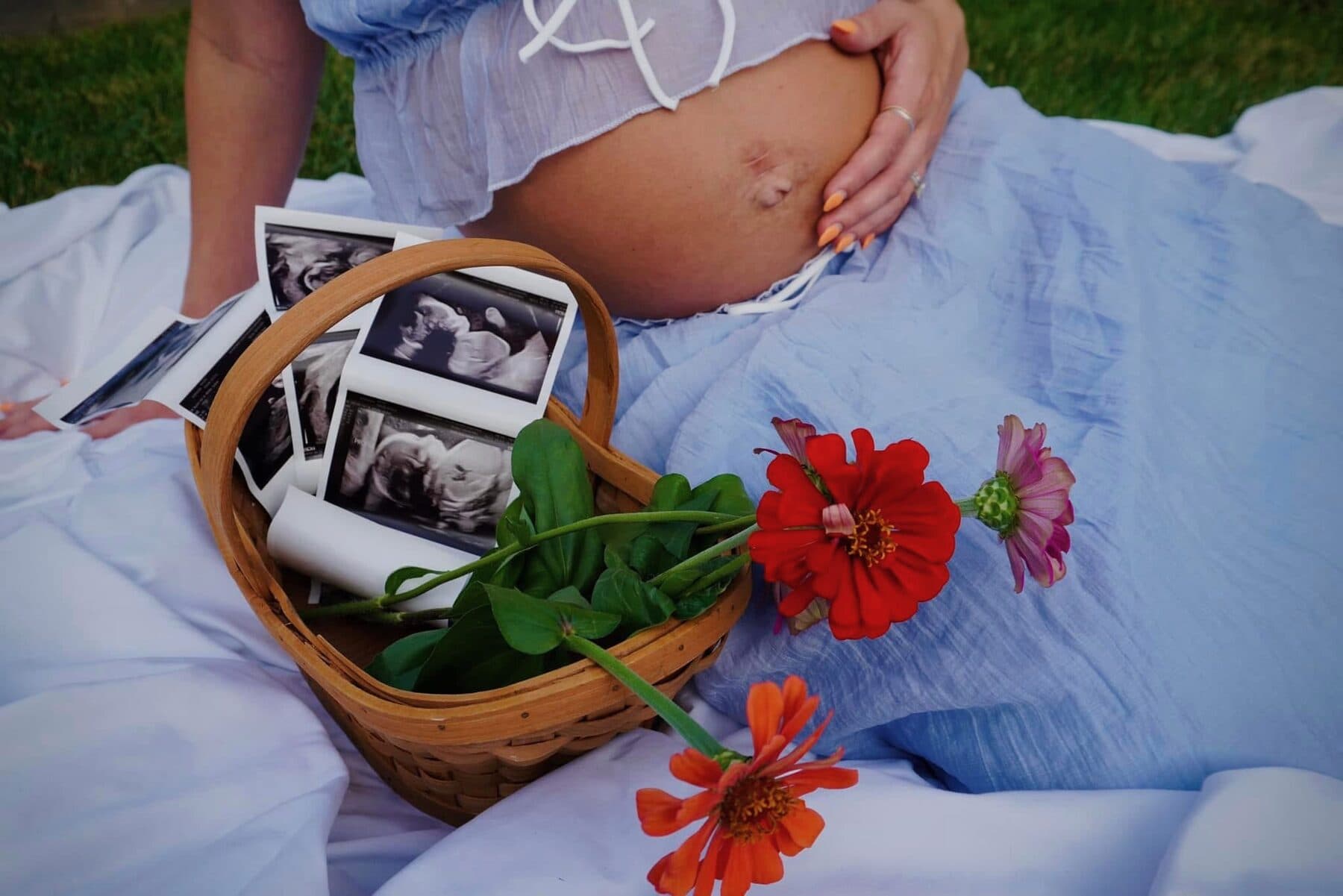 A basket of zinnias and sonogram photos