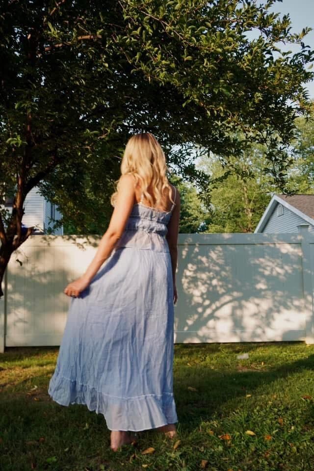 Walking the garden in a pale-blue dress