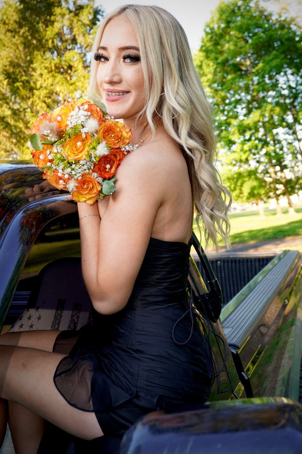 A black gown by a black truck