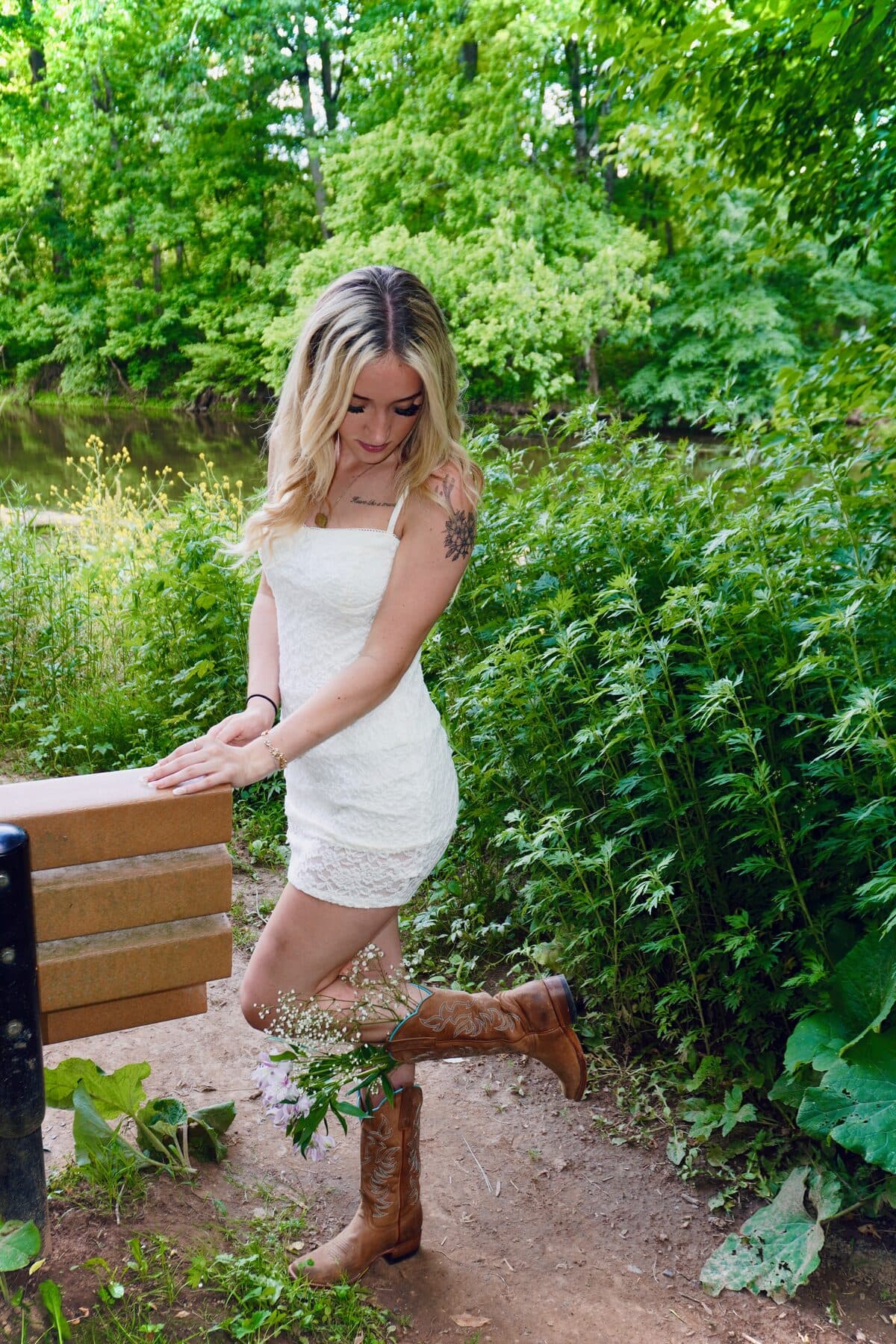 Posing with one boot up on a bench