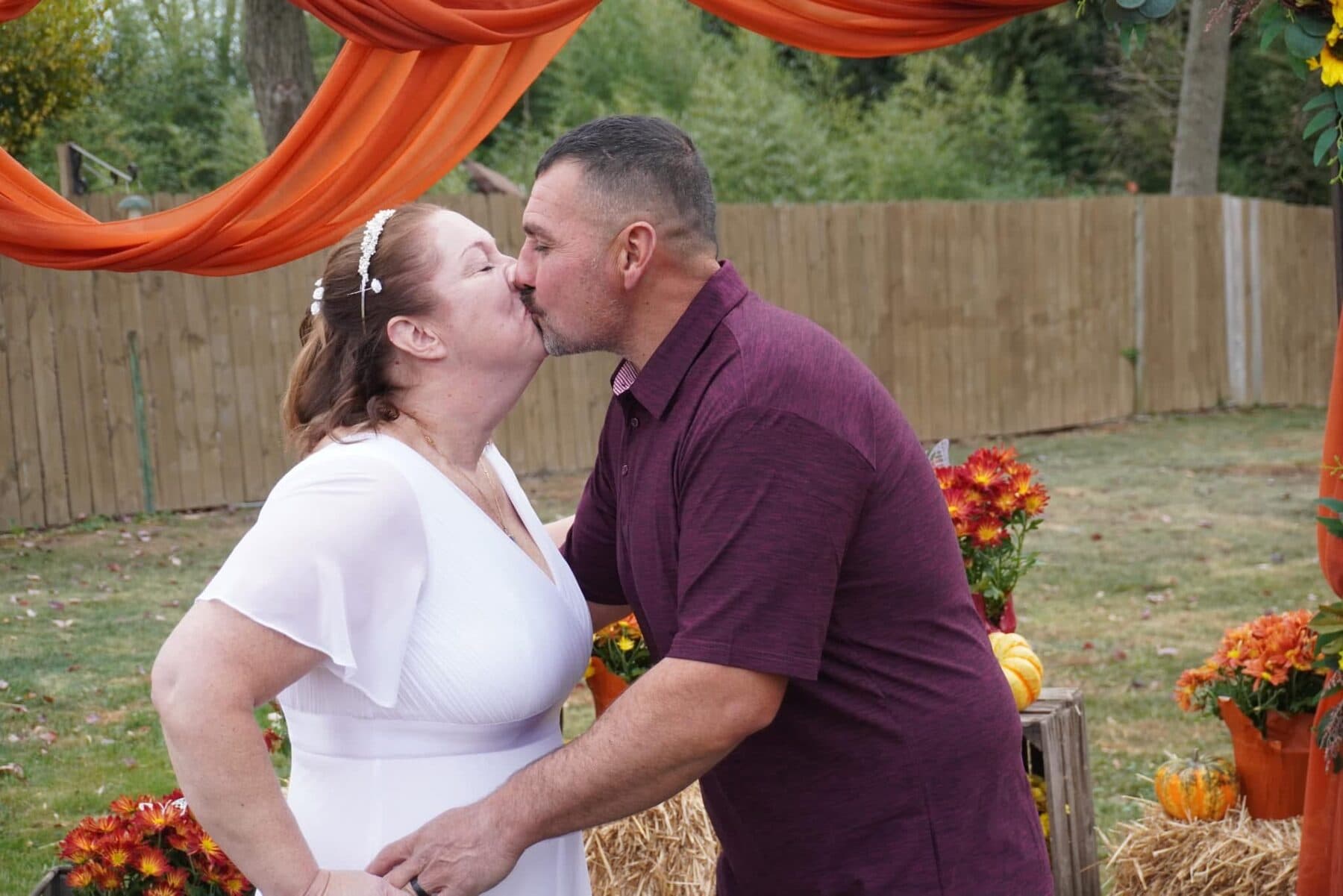 A first kiss at the sunflower arch